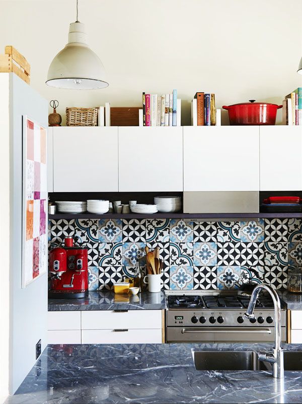 Kitchen Design Featuring Bold Backsplash and Dark Stone Countertops
