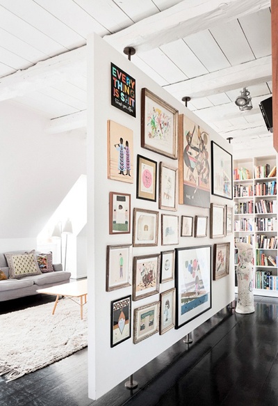 Living Room with Art Filled Partition Wall