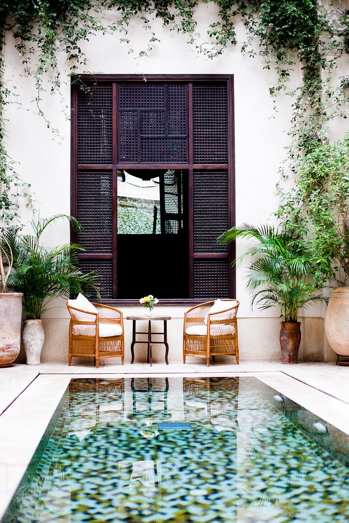 Luxurious Patio with Multicolored Tile Pool