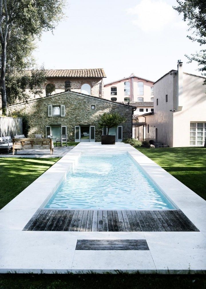 Pristine Pool with Wood Deck and Open Seating Area