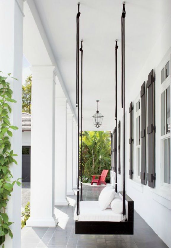Modern Porch Swing on Black and White Deck