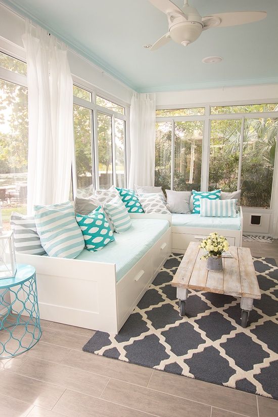 Neutral Tone Sun Room with Coffee Table on Coasters