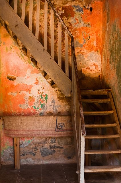Rustic Staircase with Orange Walls